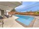 Inviting backyard pool with patio furniture, perfect for relaxation and entertaining at 1812 Renada Cir, North Las Vegas, NV 89030