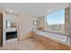 A luxurious bathtub with a view of the city skyline, adjacent to a glass shower at 2000 N Fashion Show Dr # 3307, Las Vegas, NV 89109