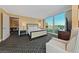 Bedroom featuring city views, neutral tones, and an inviting sitting area at 2000 N Fashion Show Dr # 3307, Las Vegas, NV 89109