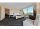Bedroom featuring city views, neutral tones, and an inviting sitting area at 2000 N Fashion Show Dr # 3307, Las Vegas, NV 89109