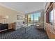 Comfortable living room featuring a sofa, accent chair, glass coffee table, and a city view at 2000 N Fashion Show Dr # 3307, Las Vegas, NV 89109