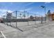 Community basketball court surrounded by a chain-link fence at 2120 Ramrod Ave # 1318, Henderson, NV 89014