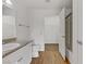 Well-lit bathroom with granite countertops, white cabinets, and a shower at 2120 Ramrod Ave # 1318, Henderson, NV 89014
