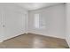 Bedroom featuring a sliding door closet, neutral colors, hardwood flooring and a window with natural light at 2120 Ramrod Ave # 1318, Henderson, NV 89014
