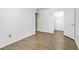 View of light-filled bedroom with light hardwood floors and white trim at 2120 Ramrod Ave # 1318, Henderson, NV 89014