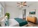 Tranquil bedroom with ceiling fan, soft natural light, and a doorway to the ensuite bathroom at 2120 Ramrod Ave # 1318, Henderson, NV 89014