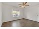 Spacious bedroom with wood-style flooring, a ceiling fan, and a bright window at 2120 Ramrod Ave # 1318, Henderson, NV 89014