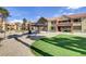 Exterior of complex featuring a covered picnic area, manicured lawn, and pleasant outdoor space at 2120 Ramrod Ave # 1318, Henderson, NV 89014