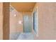 Condo entrance with a sturdy door, window, and visible fire alarm system at 2120 Ramrod Ave # 1318, Henderson, NV 89014
