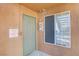 Condo entrance featuring a secure door, window, fire alarm, and unit number at 2120 Ramrod Ave # 1318, Henderson, NV 89014