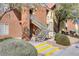 Exterior view of condo building featuring well-maintained landscaping and inviting stairwell at 2120 Ramrod Ave # 1318, Henderson, NV 89014