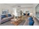 Bright living room open to dining area features modern furnishings and stylish decor at 2120 Ramrod Ave # 1318, Henderson, NV 89014