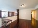 Second floor bonus room with hardwood floors, custom railing, and neutral decor at 26 E Serene Ave # 412, Las Vegas, NV 89123
