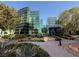 Exterior of building with glass walls, landscaping and pedestrian walkways at 26 E Serene Ave # 412, Las Vegas, NV 89123