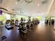 Community gym with many treadmills and elliptical machines with mirrored walls and large windows for natural light at 26 E Serene Ave # 412, Las Vegas, NV 89123