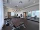 Spacious gym equipped with weights, machines, mirrors, and large windows, perfect for a complete fitness regimen at 26 E Serene Ave # 412, Las Vegas, NV 89123