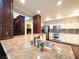 Gourmet kitchen featuring a center island, granite countertops, and modern appliances at 26 E Serene Ave # 412, Las Vegas, NV 89123