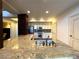 Bright kitchen features stainless steel appliances, granite countertops, and island sink at 26 E Serene Ave # 412, Las Vegas, NV 89123