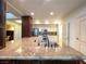 Open kitchen features stainless steel appliances, granite countertops, and a center island at 26 E Serene Ave # 412, Las Vegas, NV 89123
