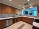 Bright kitchen area featuring white quartz counters, stainless appliances, and ample storage at 26 E Serene Ave # 412, Las Vegas, NV 89123