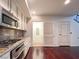 Updated kitchen boasts stainless steel appliances, gas cooktop, and wood flooring at 26 E Serene Ave # 412, Las Vegas, NV 89123