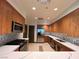 Modern kitchen with stainless steel appliances, quartz countertops, and plenty of cabinet space at 26 E Serene Ave # 412, Las Vegas, NV 89123