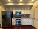 Kitchen with stainless appliances, granite countertop, and classic white cabinets at 26 E Serene Ave # 412, Las Vegas, NV 89123