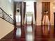 Bright living room featuring high ceilings, hardwood floors, and large windows at 26 E Serene Ave # 412, Las Vegas, NV 89123