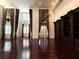 Large living room with hardwood floors, custom window treatments, and ample natural light at 26 E Serene Ave # 412, Las Vegas, NV 89123