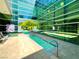 Unique lap pool design with lush landscaping, creating a peaceful oasis at 26 E Serene Ave # 412, Las Vegas, NV 89123