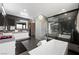 This bathroom includes a soaking tub, glass shower, and a sleek vanity with modern fixtures at 2819 Queens Courtyard Dr, Las Vegas, NV 89109