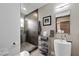 Modern bathroom features a glass-enclosed shower, floating vanity, and sleek fixtures at 2819 Queens Courtyard Dr, Las Vegas, NV 89109