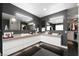 This bathroom offers modern vanities with dual sinks, large mirrors and custom closet access at 2819 Queens Courtyard Dr, Las Vegas, NV 89109