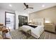 Comfortable bedroom with king bed, sliding door to outdoor stairs and modern furnishings at 2819 Queens Courtyard Dr, Las Vegas, NV 89109