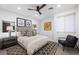Cozy bedroom with neutral tones, a comfortable queen bed, and stylish decor at 2819 Queens Courtyard Dr, Las Vegas, NV 89109