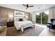 Bright bedroom with a ceiling fan, a comfortable king bed, and a sliding door to balcony at 2819 Queens Courtyard Dr, Las Vegas, NV 89109