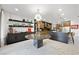 Open concept featuring a marble dining table, bar, and views of the modern kitchen at 2819 Queens Courtyard Dr, Las Vegas, NV 89109