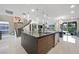 Spacious kitchen island with stainless steel appliances and modern finishes, flowing into an open floor plan at 2819 Queens Courtyard Dr, Las Vegas, NV 89109