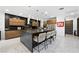 Contemporary kitchen featuring a center island, stainless steel appliances, and custom wooden cabinetry at 2819 Queens Courtyard Dr, Las Vegas, NV 89109