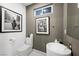 Modern powder room with unique sink fixture, stylish decor, and black and white accents at 2819 Queens Courtyard Dr, Las Vegas, NV 89109
