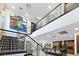 Elegant staircase with sleek railings offering views of the kitchen and open living space at 2819 Queens Courtyard Dr, Las Vegas, NV 89109