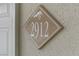 Close up of unit address sign with decorative tree logo at 2831 Geary Pl # 2912, Las Vegas, NV 89109