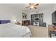 Comfortable bedroom boasts a ceiling fan, dresser, workstation, and neutral color palette at 2831 Geary Pl # 2912, Las Vegas, NV 89109