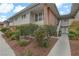 Multi-Gathering building with lush landscaping and a sidewalk leading to the staircase of the units at 2831 Geary Pl # 2912, Las Vegas, NV 89109