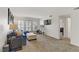Spacious living room with neutral carpet, plantation shutters, and ample natural light at 2831 Geary Pl # 2912, Las Vegas, NV 89109