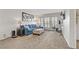 Well-lit living room featuring neutral carpet, comfortable seating, and a functional workspace at 2831 Geary Pl # 2912, Las Vegas, NV 89109