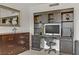 Functional workstation with built-in shelves and drawers, paired with a dresser and mirror at 2831 Geary Pl # 2912, Las Vegas, NV 89109
