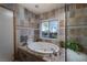 Bathroom with oversized tub and large window at 2917 Chapala Dr, Las Vegas, NV 89120