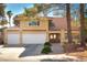 Charming two-story home featuring a well-manicured yard and a two car garage at 2917 Chapala Dr, Las Vegas, NV 89120