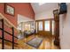 Foyer featuring hardwood floors, staircase, and a beautiful entry door at 2917 Chapala Dr, Las Vegas, NV 89120